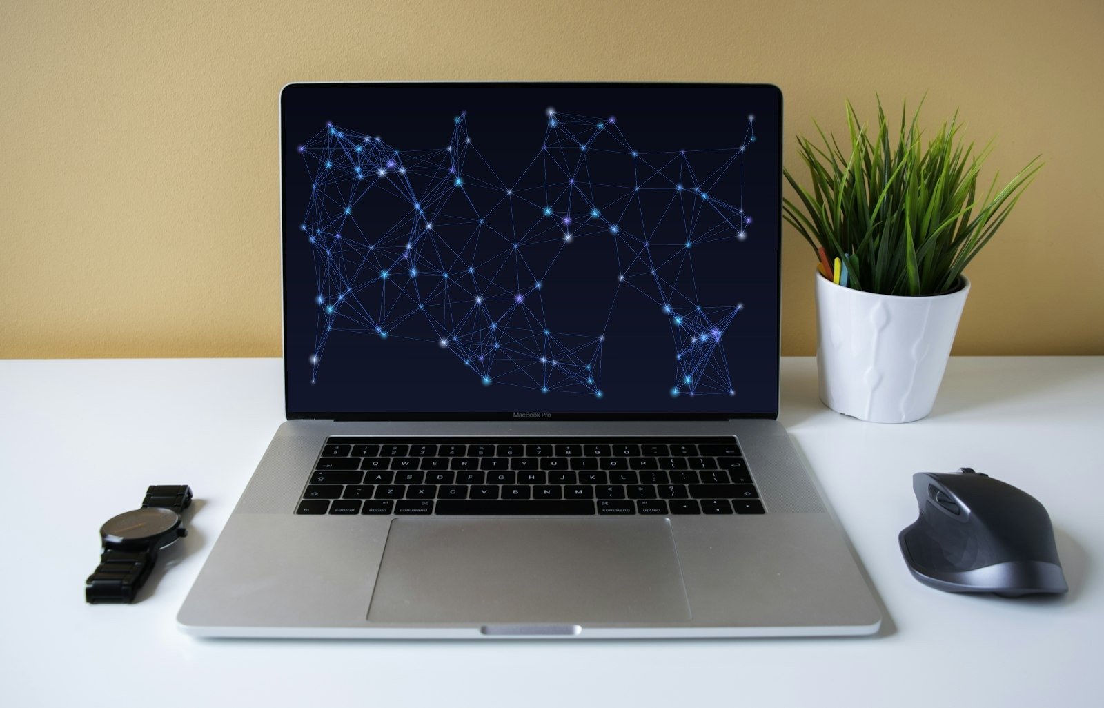 MacBook Pro con una visualización de red neuronal en pantalla